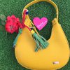 noco bolso amarillo mostaza